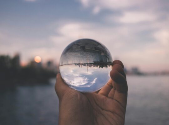 person holding crystal ball