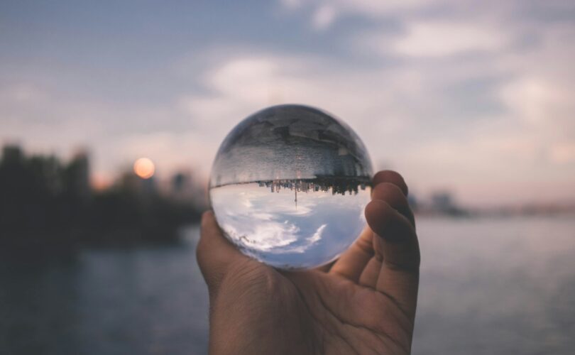 person holding crystal ball